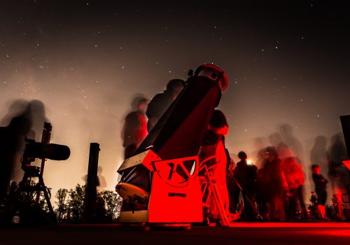 Photo of telescope at night